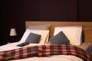 Postel nebo postele na pokoji v ubytování B&B Les Dépendances