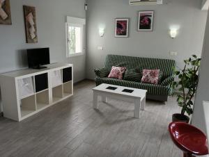 TV a/nebo společenská místnost v ubytování Urbanizacion el Palmar