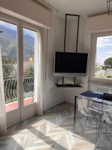 A television and/or entertainment centre at La Casa Verde Torbole