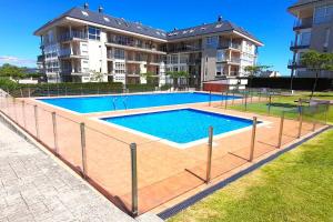 Zdjęcie z galerii obiektu APARTAMENTO PLAYA FOZ CON JARDIN Y PISCINA w mieście Foz