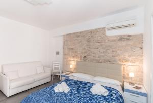 Postel nebo postele na pokoji v ubytování B&B Bianco E Blu