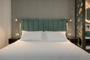 Postel nebo postele na pokoji v ubytování Hotel Sole