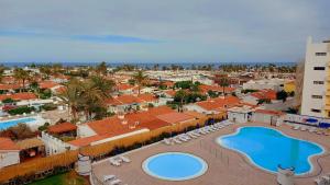 an aerial view of a resort with a swimming pool at Playa del ingles Tamaran apartamento 509 in Maspalomas