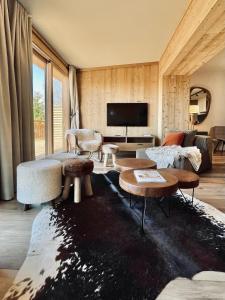 Televízia a/alebo spoločenská miestnosť v ubytovaní Chalet Snö 1750