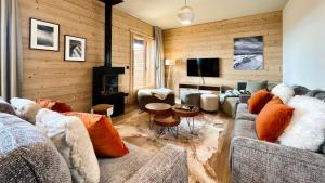 Televízia a/alebo spoločenská miestnosť v ubytovaní Chalet Snö 1750