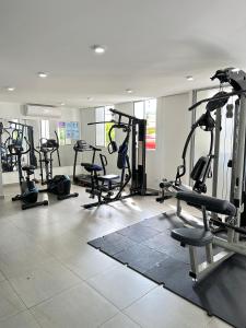 a gym with a bunch of treadms and machines at Apartamento Amoblado Luxury Excelente Ubicacion in Cúcuta