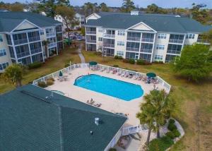 an aerial view of a large apartment complex with a swimming pool at NEW! Gated Community, Pools, Gym, Beach @ Ocean Keyes #1721 in Myrtle Beach