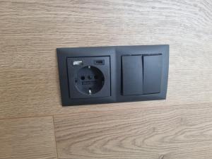 a small black safe on the floor at New and well furnished studio apartment for two 30 km from Kirkjubæjarklaustur Perfect place to stay at right between Black beach and Jökulsárlón in Kirkjubæjarklaustur