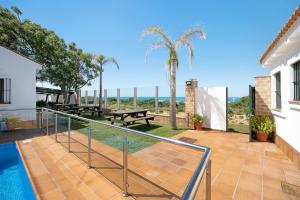 a patio with a view of the ocean from a house at Novobarrosa A in Chiclana de la Frontera