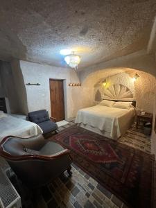 Postel nebo postele na pokoji v ubytování Uchisar Cave House + 33 fotografií