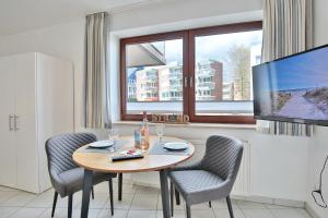 TV a/nebo společenská místnost v ubytování Strandburg Strandburg Appartement 1