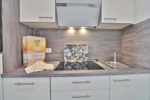 Kuchyň nebo kuchyňský kout v ubytování Strandburg Strandburg Appartement 1 + 11 fotografií