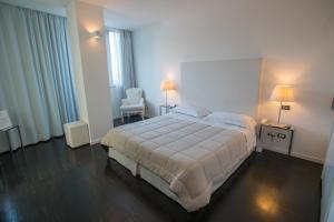 Postel nebo postele na pokoji v ubytování Hotel iDesign