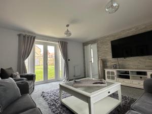 TV a/nebo společenská místnost v ubytování High Mill House