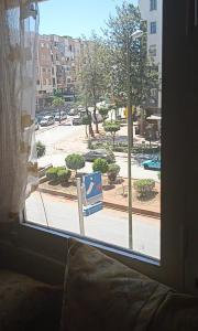a window with a view of a city street at Meknès adrae in Meknès