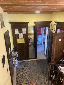 a room with two doors and a room with a bed at Bed&Wine in Brisighella +9 photos