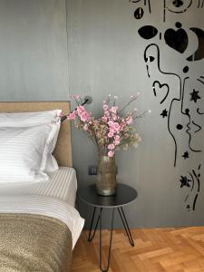 Postel nebo postele na pokoji v ubytování Arka Art Hotel