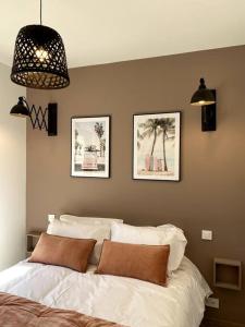 Ένα ή περισσότερα κρεβάτια σε δωμάτιο στο La Cabane des Surfeurs