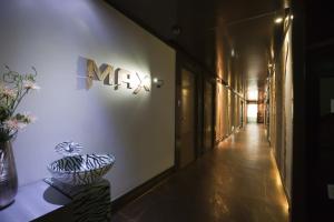 a hallway with a vase on the side of a wall at Max Motel - Sasang in Busan