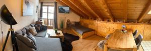 a living room with a couch and a table at Edelweiss -229- in Mittenwald