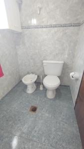 a bathroom with a toilet and a bidet at Alquiler por día/semana in Ciudad Lujan de Cuyo