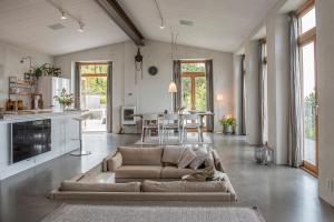 a living room with a couch and a table at Bergshuset in Visby