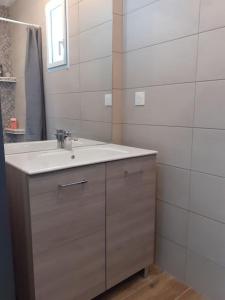 a bathroom with a sink and a mirror at chez Virginie et Jacky in Les Épesses