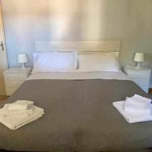 Postel nebo postele na pokoji v ubytování Hotel Helvetia