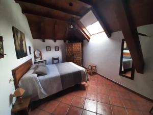 a bedroom with a bed in a room with a window at CASA GRACIANO I in Ochagavía