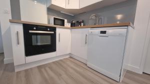 Kuchyňa alebo kuchynka v ubytovaní Résidence Anthérieu - Appartements neufs tout confort