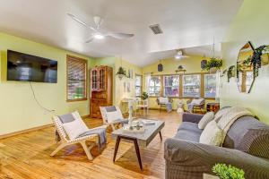 a living room with a couch and a table at Downtown Gem- Dog Friendly Walk to Everything in Saint Augustine