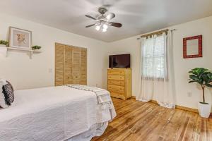 a bedroom with a bed and a ceiling fan at Downtown Gem- Dog Friendly Walk to Everything in Saint Augustine
