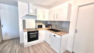Kuchyňa alebo kuchynka v ubytovaní Résidence Anthérieu - Appartements neufs tout confort