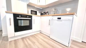 Kuchyňa alebo kuchynka v ubytovaní Résidence Anthérieu - Appartements neufs tout confort