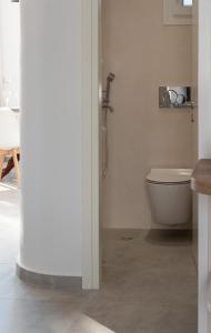 a bathroom with a toilet and a shower at Naxian sun apartment in Naxos Chora