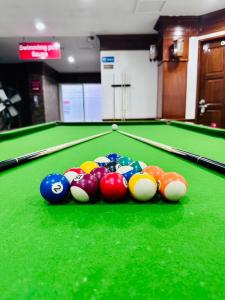 a group of billiard balls on a pool table at Lime Hotel in Patong Beach