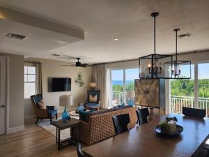 a living room with a couch and a table at Hideaway - 3br-2,5ba in Key Largo