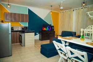 a kitchen and living room with a table and chairs at Nay homes - Mtwapa pride in Mtwapa