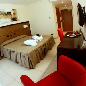 Postel nebo postele na pokoji v ubytování Hotel Novarello