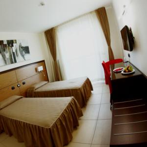 Postel nebo postele na pokoji v ubytování Hotel Novarello