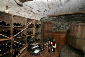 a room with a bunch of bottles of wine at Pensione Ca' Serafina in Lodano