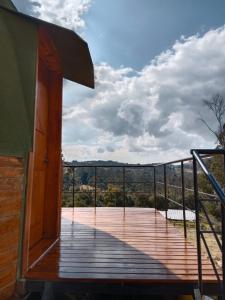 a view from the deck of a house at Glamping San Sebastian in Suesca