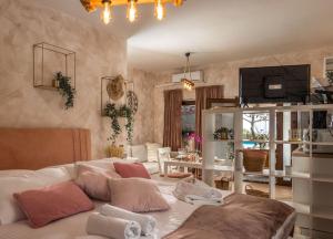 a room with a bed and a living room at Piccola Villa Adriatic, with heated swimming pool, Opatija in Ičići