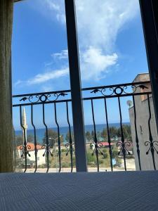 a view of a balcony with a view of the ocean at Paperon Hotel in Limonlu