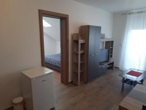 Ένα ή περισσότερα κρεβάτια σε δωμάτιο στο Ekskluziv