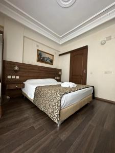 Ένα ή περισσότερα κρεβάτια σε δωμάτιο στο Paperon Hotel