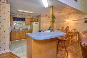 a kitchen with a blue counter top in a room at Mountain Hideaway, 1 Bedroom, Sleeps 2, Wood Fireplace, WiFi, Pool Table in Gatlinburg