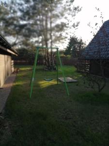 a swing set in the yard of a backyard at Fajna Chata in Sasino