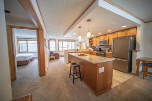 a kitchen with a refrigerator and a counter top at Pines 2086 in Keystone