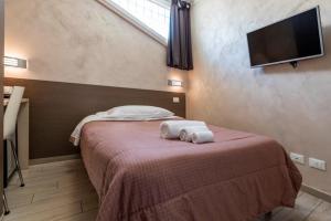 Postel nebo postele na pokoji v ubytování Affittacamere Borgo Roma